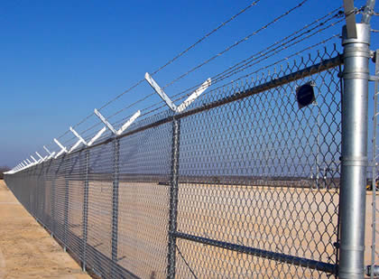 Barbed wire security fencing installation
