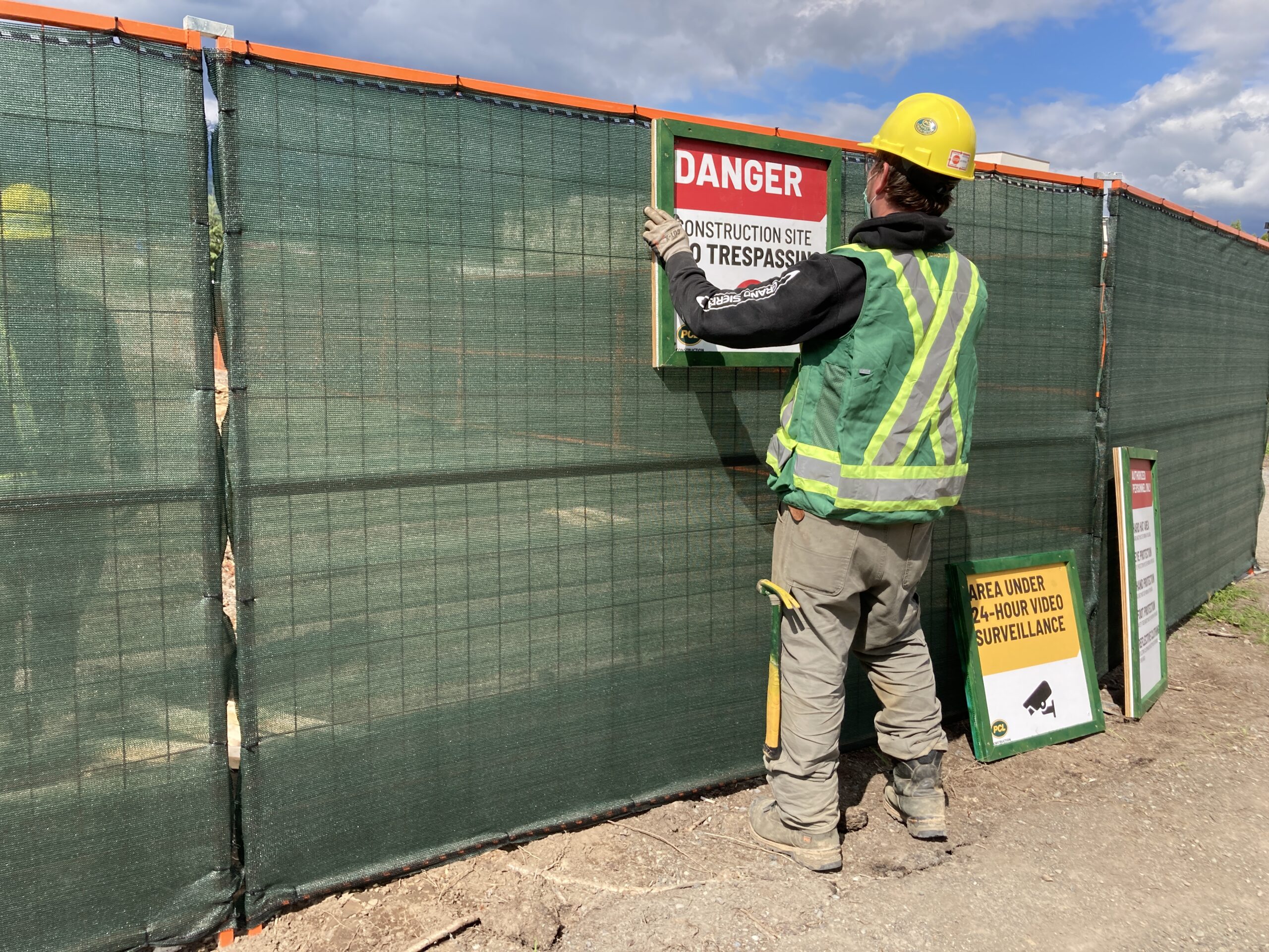 Construction site with complete fencing installation