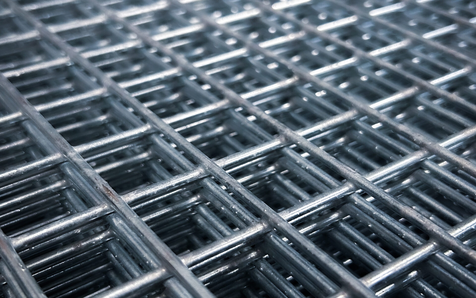 Rigid welded wire mesh panels for construction
